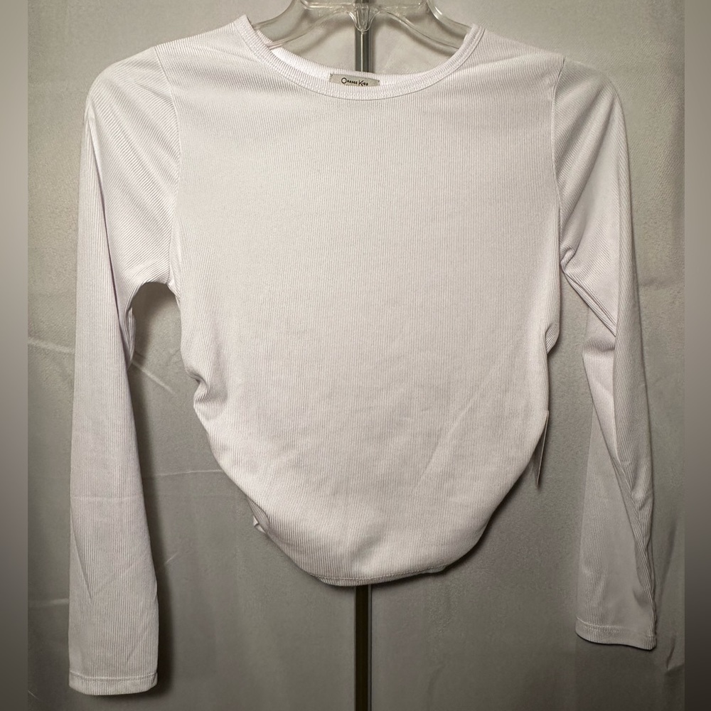 Orange Kiss Essentials long-sleeve top. NWT. Size L. Polyester & spandex blend.